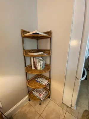 a shelf in a kitchen next to a refrigerator at Mae Sweet Home in Surrey
