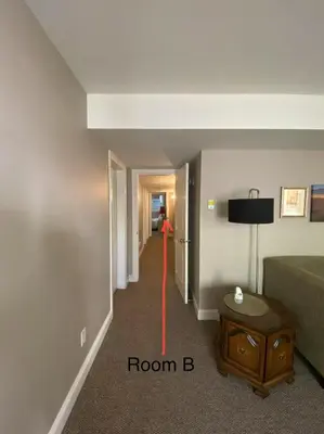 a hallway with a room b with a red line on the wall at Mae Sweet Home in Surrey