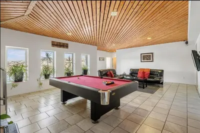a living room with a pool table in it at Carbon Valley Ranch in Grainger