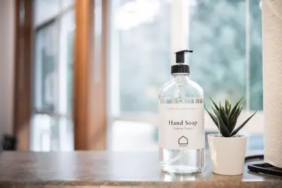 a bottle of hand soap sitting on a table at Granite Court by Outpost Whistler in Whistler