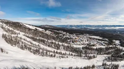 an aerial view of a snow covered mountain at Mountain Time - Spacious w Private Hot Tub and an Amazing View in Big White