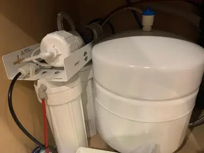 a white toilet with a machine next to it at Mountain View Escape with Private Hot Tub & Patio in Canmore