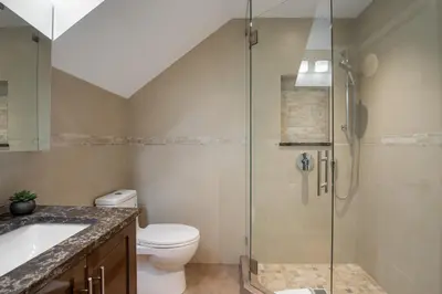 a bathroom with a shower and a toilet and a sink at 3BR in Snowgoose, Ski In, Luxury Property, Free Shuttle to Lifts, Parking in Whistler
