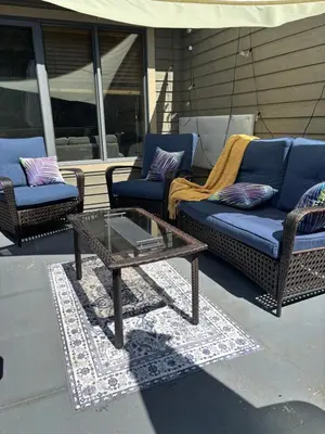 a patio with two couches and a coffee table at Radium Villas in Radium Hot Springs