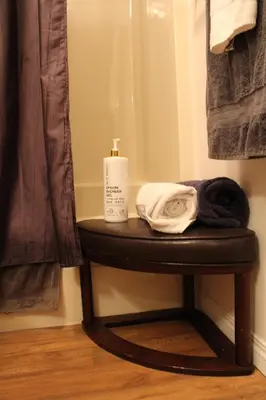 a small table with a bottle of soap on it at Radium Villas in Radium Hot Springs