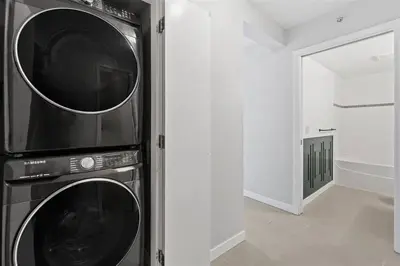 a kitchen with two microwaves stacked on top of each other at Beautiful 1 BR in the Heart of Downtown: Parking, Pool & Gym in Vancouver