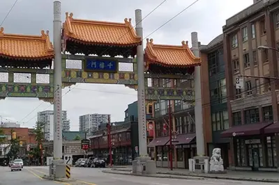 a city street with a chinese gate in a city at Beautiful 1 BR in the Heart of Downtown: Parking, Pool & Gym in Vancouver