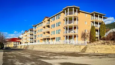 a large apartment building on the side of a street at Mountain View Suites by StayIn in Fairmont Hot Springs