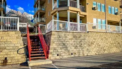 a building with a red staircase in front of it at Mountain View Suites by StayIn in Fairmont Hot Springs