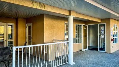a building with a sign on the side of it at Mountain View Suites by StayIn in Fairmont Hot Springs
