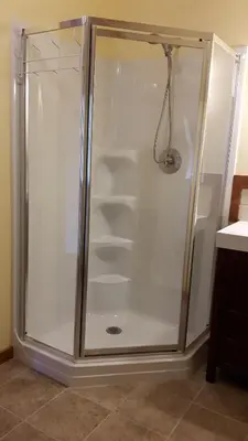 a glass shower with shelves in a bathroom at Tschurtschenthaler Rentals in Golden