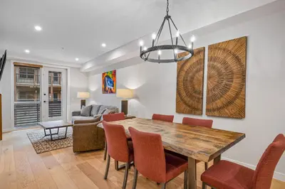 a dining room with a table and chairs at Spring Creek Vacations in Canmore