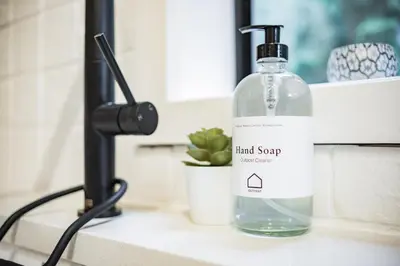 a bottle of liquid soap sitting on a counter at Powderview 24 by Outpost Whistler in Whistler