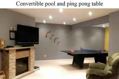 a living room with a pool table and a tv at Mountain Calm & Private Ensuite Hosted by Maureen in Calgary