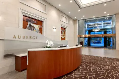 an office with a reception desk in a lobby at Auberge Vancouver Hotel in Vancouver