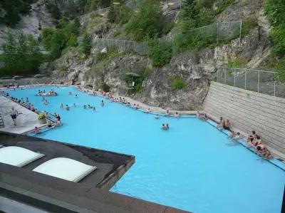 a group of people swimming in a blue pool at Lookout Pointe, Lakeview, Pool, Hot Tub, Gym in Invermere