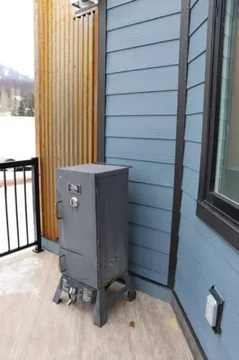 a metal box sitting on the side of a house at Ski in Ski Out with Huge Game Room and Hot Tub in Fernie