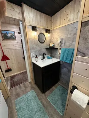 a bathroom with a sink and a shower at The Cabin in Stewart