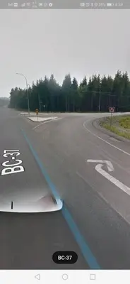 a view from the wing of a car on a road at LuxQuarters Kitimat River Suite in Kitimat
