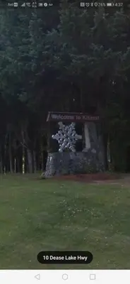 a monument in a park with a sign on it at LuxQuarters Kitimat River Suite in Kitimat
