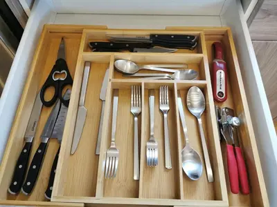 a drawer filled with utensils in a box at LuxQuarters Kitimat River Suite in Kitimat