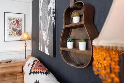 a room with a shelf with potted plants on a wall at The Downtown Hive by Revelstoke Vacations in Revelstoke