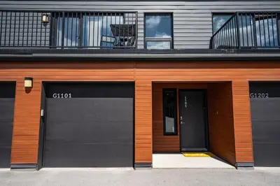 two garage doors on the side of a building at RendezView by Revelstoke Vacations in Revelstoke