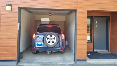 a car is parked inside of a garage at Al's Escape by Revelstoke Vacations in Revelstoke