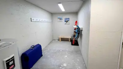 a room with a hallway with a table and a shelf at Al's Escape by Revelstoke Vacations in Revelstoke