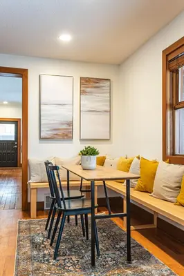 a living room with a table and a couch at Mackenzie House by Revelstoke Vacations in Revelstoke