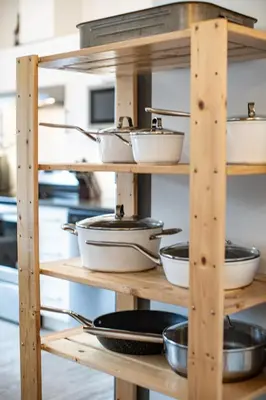 a shelf with pots and pans on it in a kitchen at Niska's Den by Revelstoke Vacations in Revelstoke