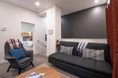 a living room with a couch and a chair at Alpine Escape by Revelstoke Vacations in Revelstoke