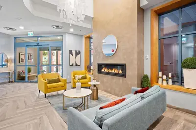 a lobby with two couches and a fireplace at Alpenglow Lodge Studio with Pool Views by MVA in Whistler