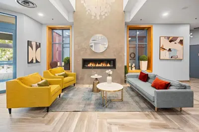 a living room with two couches and a fireplace at Alpenglow Lodge Family Studio with Murphy Bed by MVA in Whistler