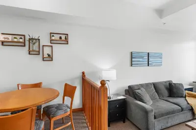 a living room with a couch and a table at Alpenglow Lodge Family & Work Retreat by MVA in Whistler