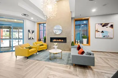 a living room with two couches and a fireplace at Alpenglow Lodge Two Bedroom Apartment with Private Hot Tub by MVA in Whistler