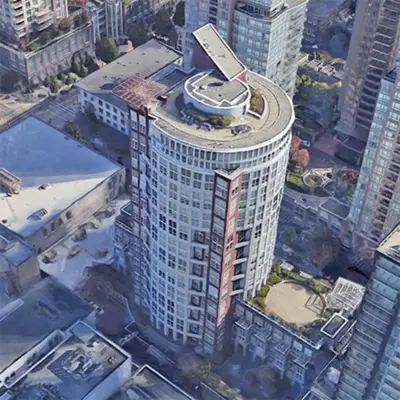 an overhead view of a tall building in a city at Beautiful Downtown Loft with full kitchen in Vancouver