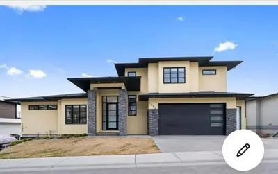 a rendering of a house with a garage at Kelowna new lake view 2bedrooms close BIG WHITE in Kelowna