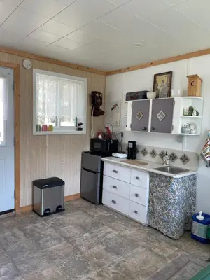 a kitchen with a sink and a stove at Jade City Dog House in Jade City