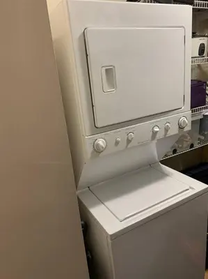 a white refrigerator with its door open in a kitchen at Chris Cozy Condo Commonwealth #205 Edmonton in Edmonton