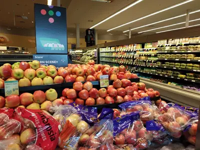 a store filled with lots of apples and other fruits and vegetables at Private Suite w King Bed, Ground Level, Naturally Bright in Vancouver