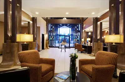 a lobby with chairs and a table in a building at Beautiful 2 bedroom town home in Sunrise Ridge in Parksville