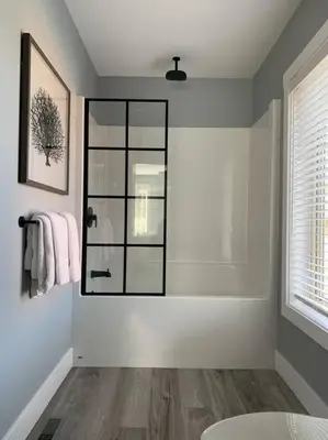 a bathroom with a shower with a glass door at Beautiful 2 bedroom town home in Sunrise Ridge in Parksville