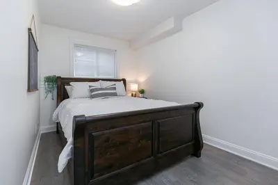 a bedroom with a large bed in a room at Cozy Renovated Oasis W Private Terrace & Parking in Victoria