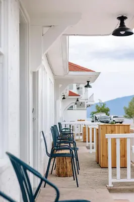 a row of chairs sitting on the side of a building at Kettle Valley Beach Resort in Penticton