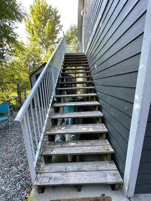 a stairway leading up to a building at Cozy loft in Upper Gibsons in Gibsons
