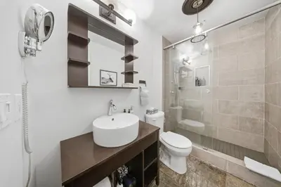 a bathroom with a sink and a toilet and a shower at Newly renovated Blue Sky - Family Fun - 2 Bed -2 Bath in Canmore