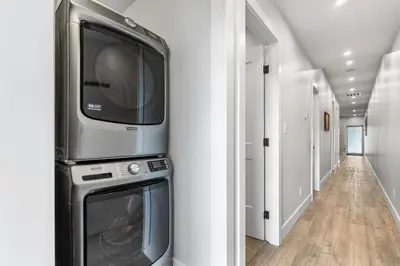 a large television on top of a appliance in a hallway at Beach Suites in Parksville