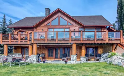 a log home with a large deck and patio at Pine Ridge, Log Home with Lake View and Backyard in Invermere