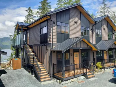 a house with a staircase leading up to it at Halibut Hideaway in Port Renfrew